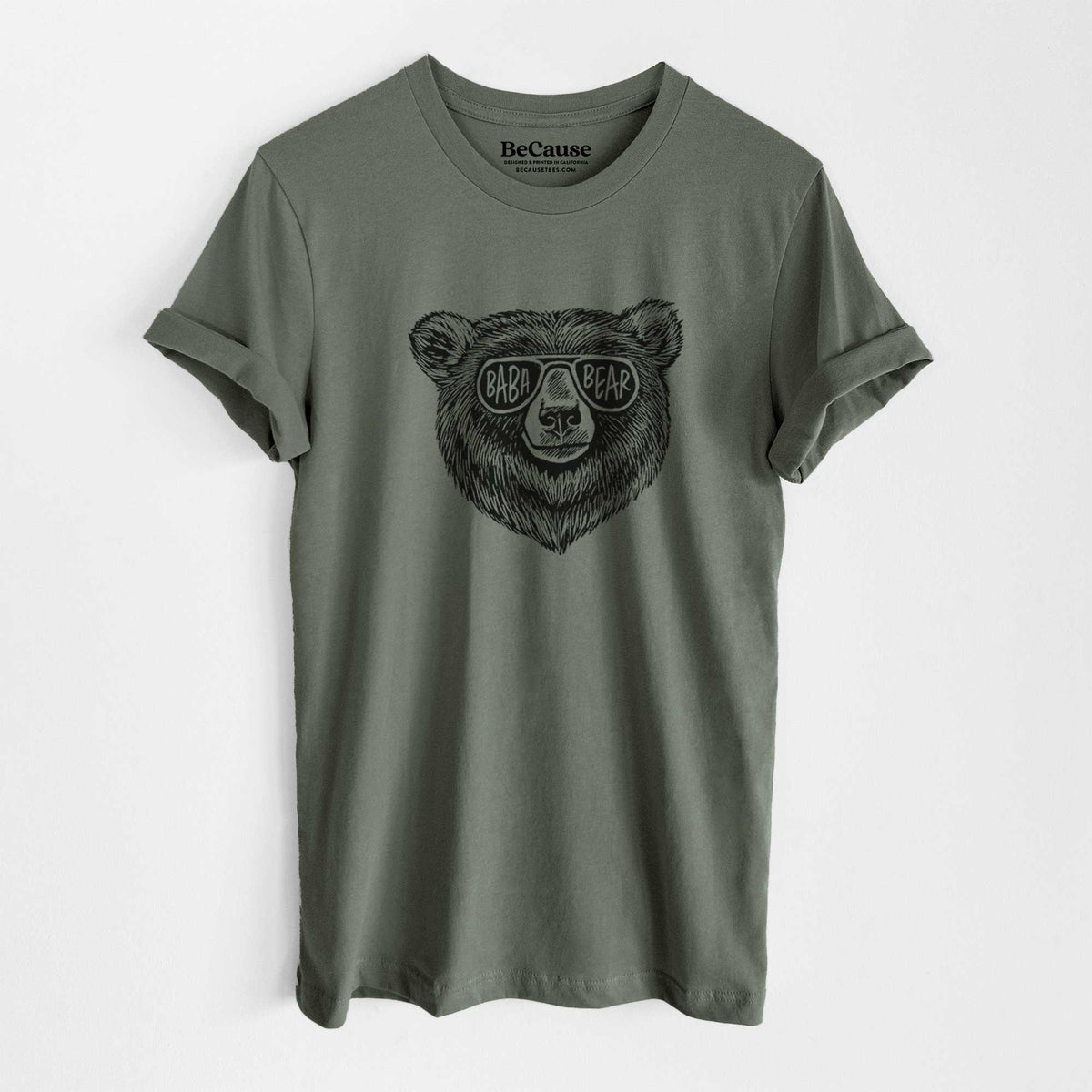 Military green lightweight cotton t-shirt laid flat, printed with a black ink bear's face wearing sunglasses that read Baba Bear.