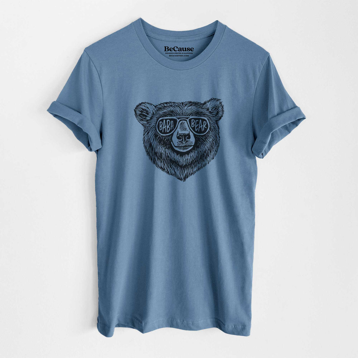 Steel blue lightweight cotton t-shirt laid flat, printed with a black ink bear's face wearing sunglasses that read Baba Bear.