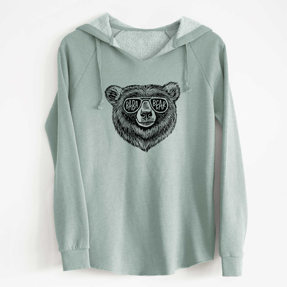 Sage green women's Cali Wave hooded sweatshirt laid flat, printed with a black ink bear's face wearing sunglasses that read Baba Bear.