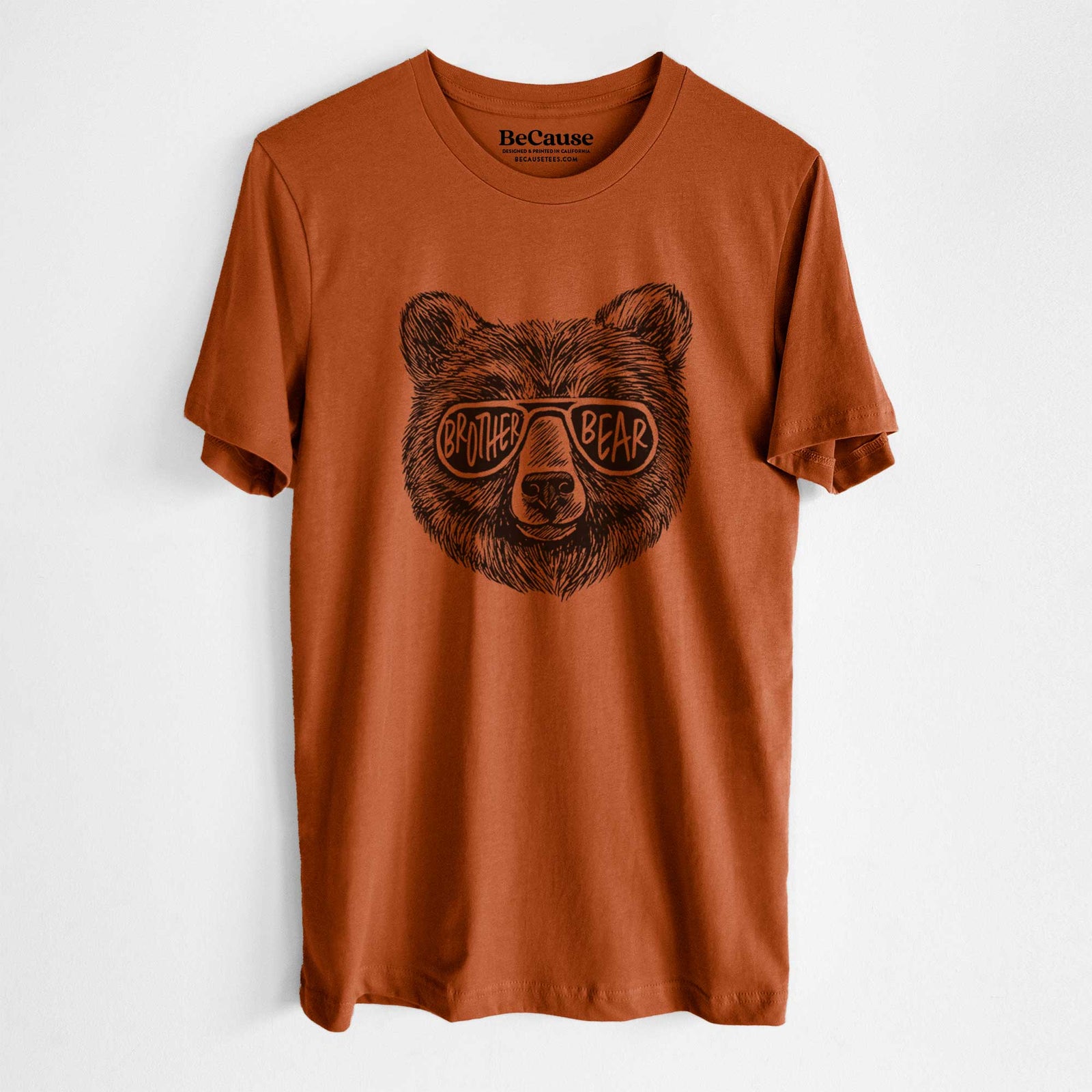 Steel blue lightweight cotton t-shirt laid flat, printed with a black ink bear's face wearing sunglasses that read Brother Bear.