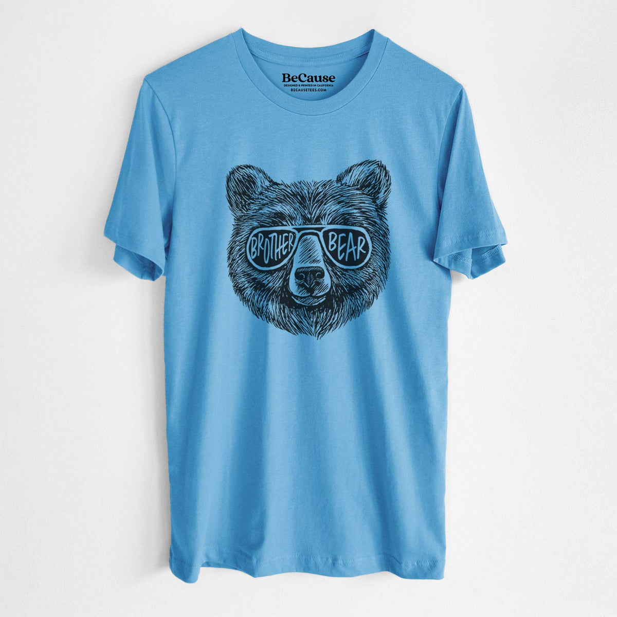 Ocean blue lightweight cotton t-shirt laid flat, printed with a black ink bear's face wearing sunglasses that read Brother Bear.