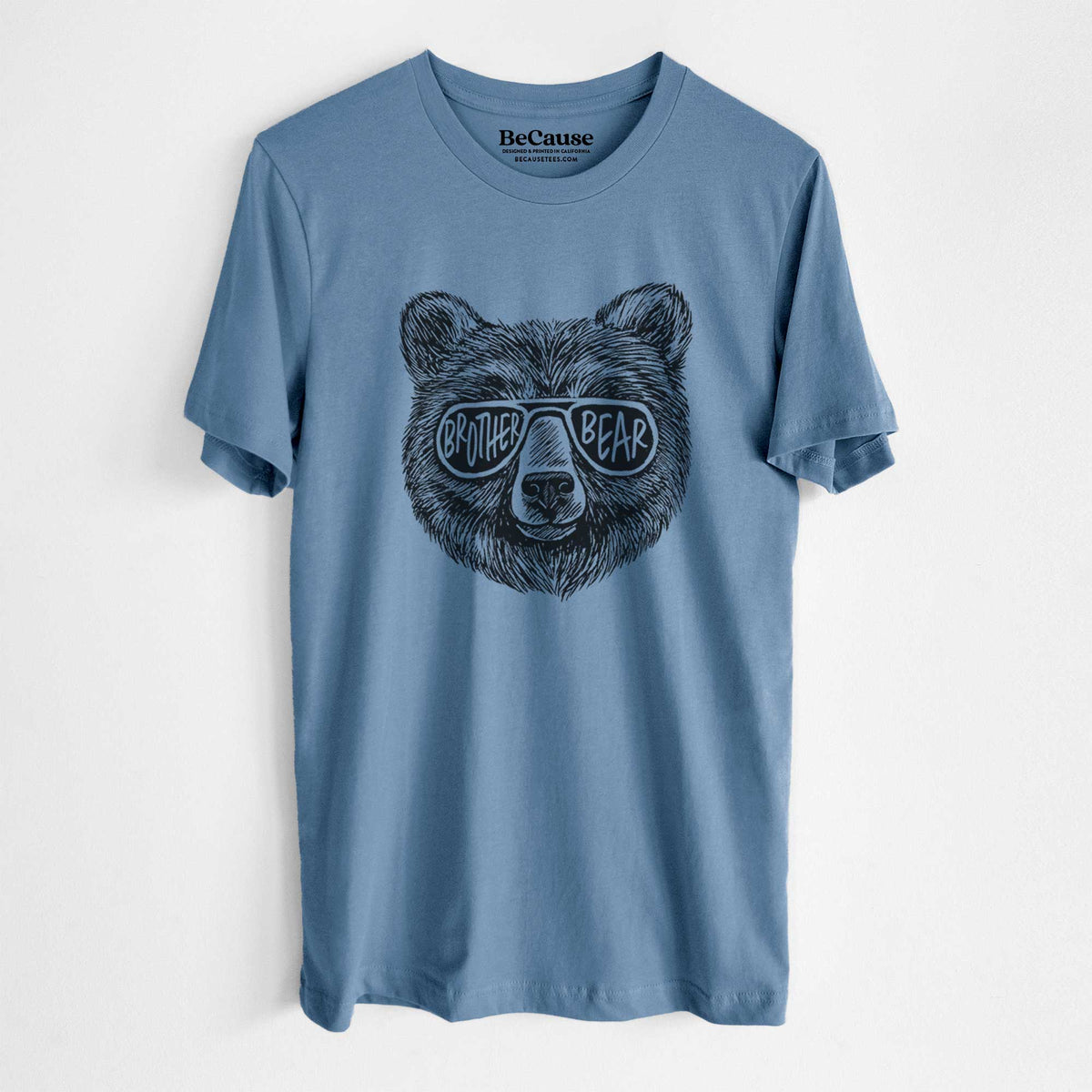 Steel blue lightweight cotton t-shirt laid flat, printed with a black ink bear's face wearing sunglasses that read Brother Bear.