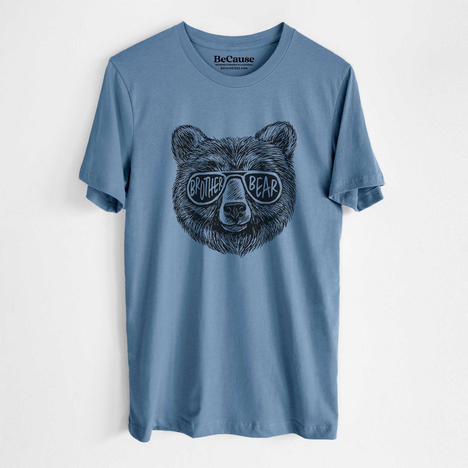 Steel blue lightweight cotton t-shirt laid flat, printed with a black ink bear's face wearing sunglasses that read Brother Bear.