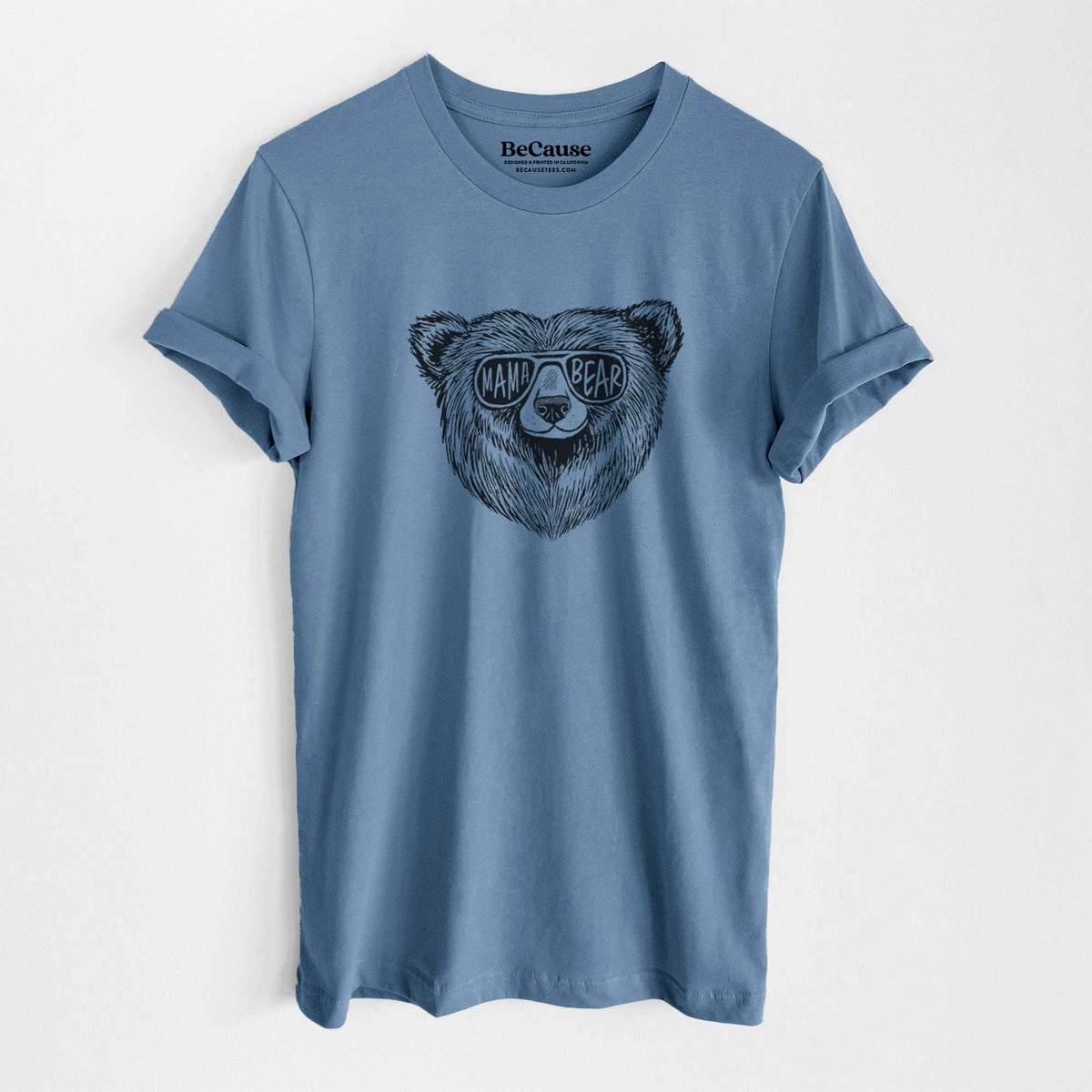 Steel blue lightweight cotton t-shirt laid flat, printed with a black ink bear's face wearing sunglasses that read Mama Bear.