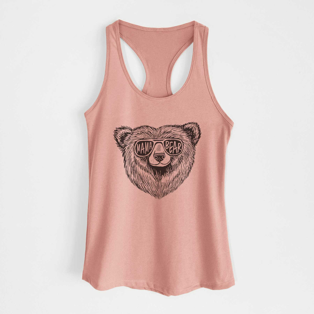 Desert pink women's racerback tank top laid flat, printed with a black ink bear's face wearing sunglasses that read Mama Bear.