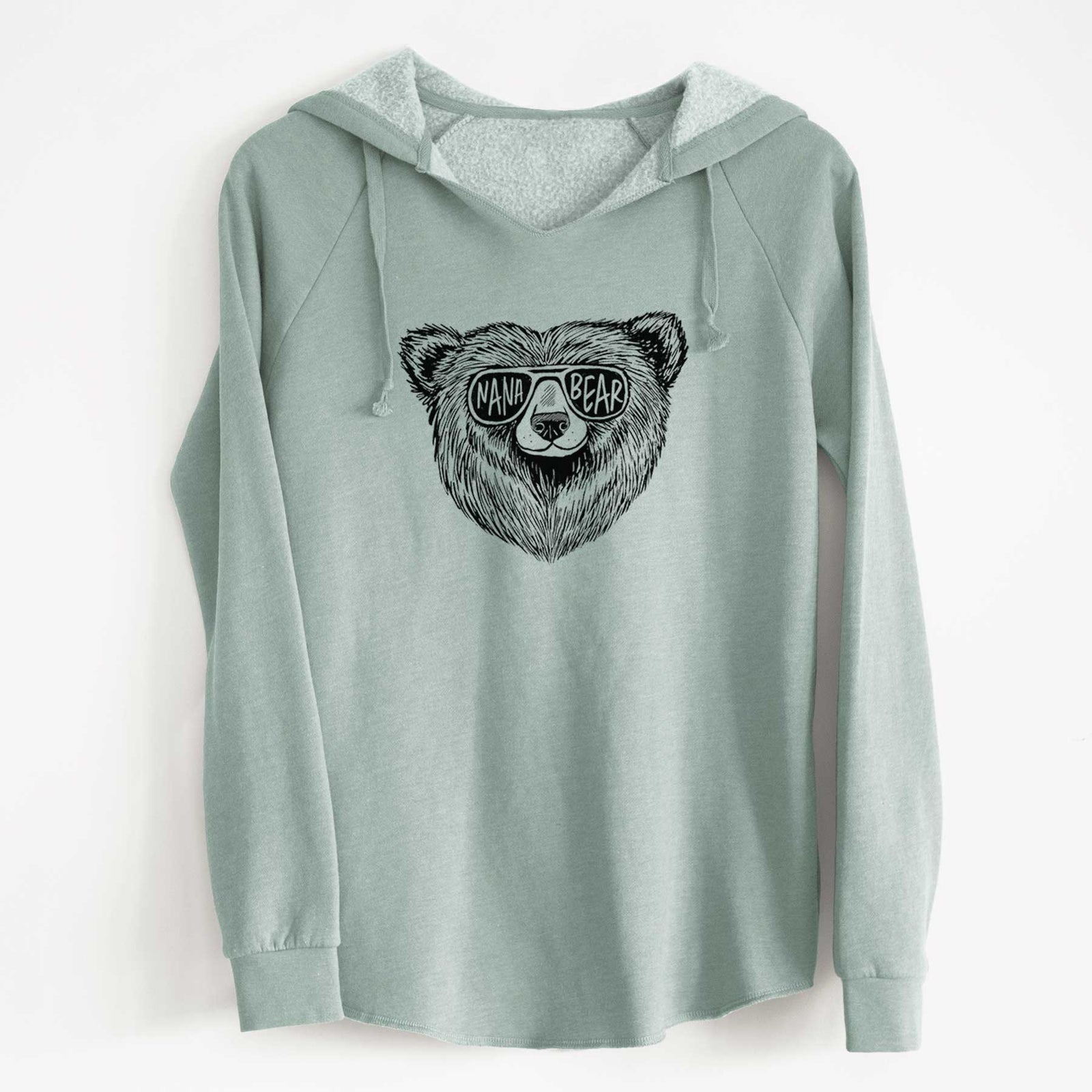 Sage green women's Cali Wave hooded sweatshirt laid flat, printed with a black ink bear's face wearing sunglasses that read Nana Bear.