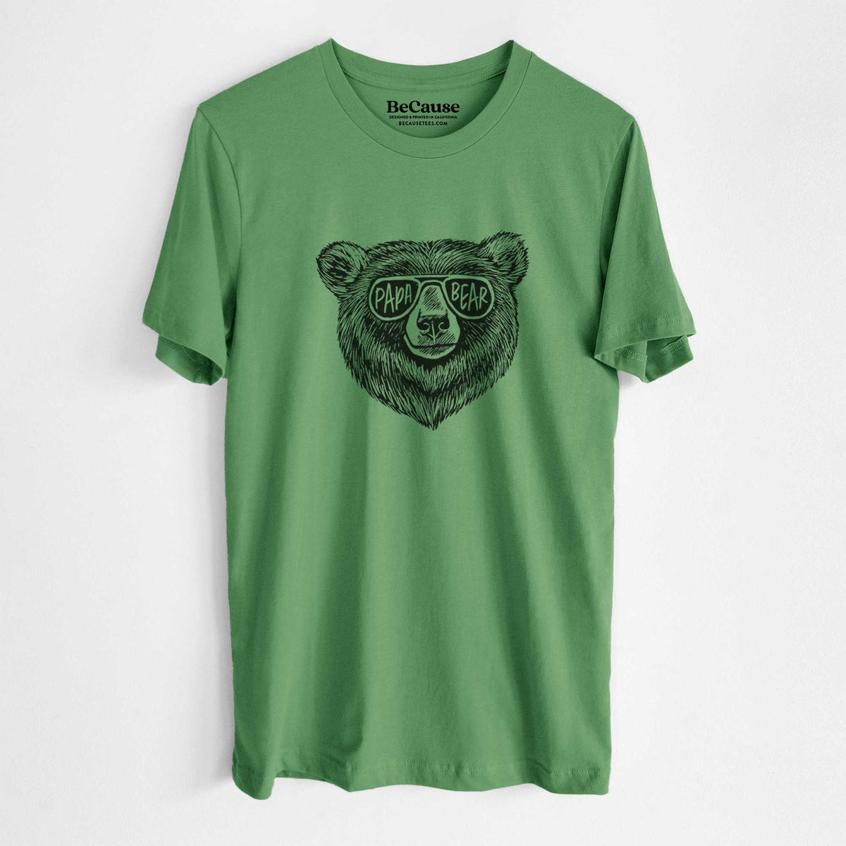 Leaf green lightweight cotton t-shirt laid flat, printed with a black ink bear's face wearing sunglasses that read Papa Bear.