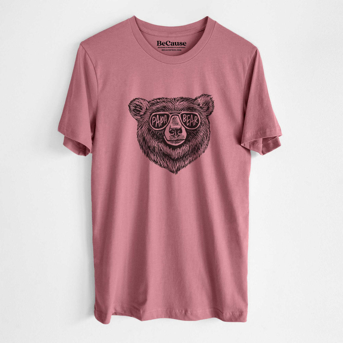 Mauve pink lightweight cotton t-shirt laid flat, printed with a black ink bear's face wearing sunglasses that read Papa Bear.