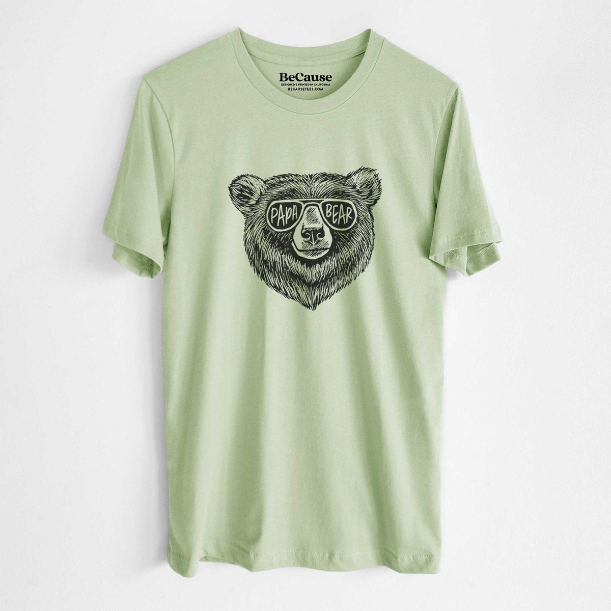 Spring green lightweight cotton t-shirt laid flat, printed with a black ink bear's face wearing sunglasses that read Papa Bear.