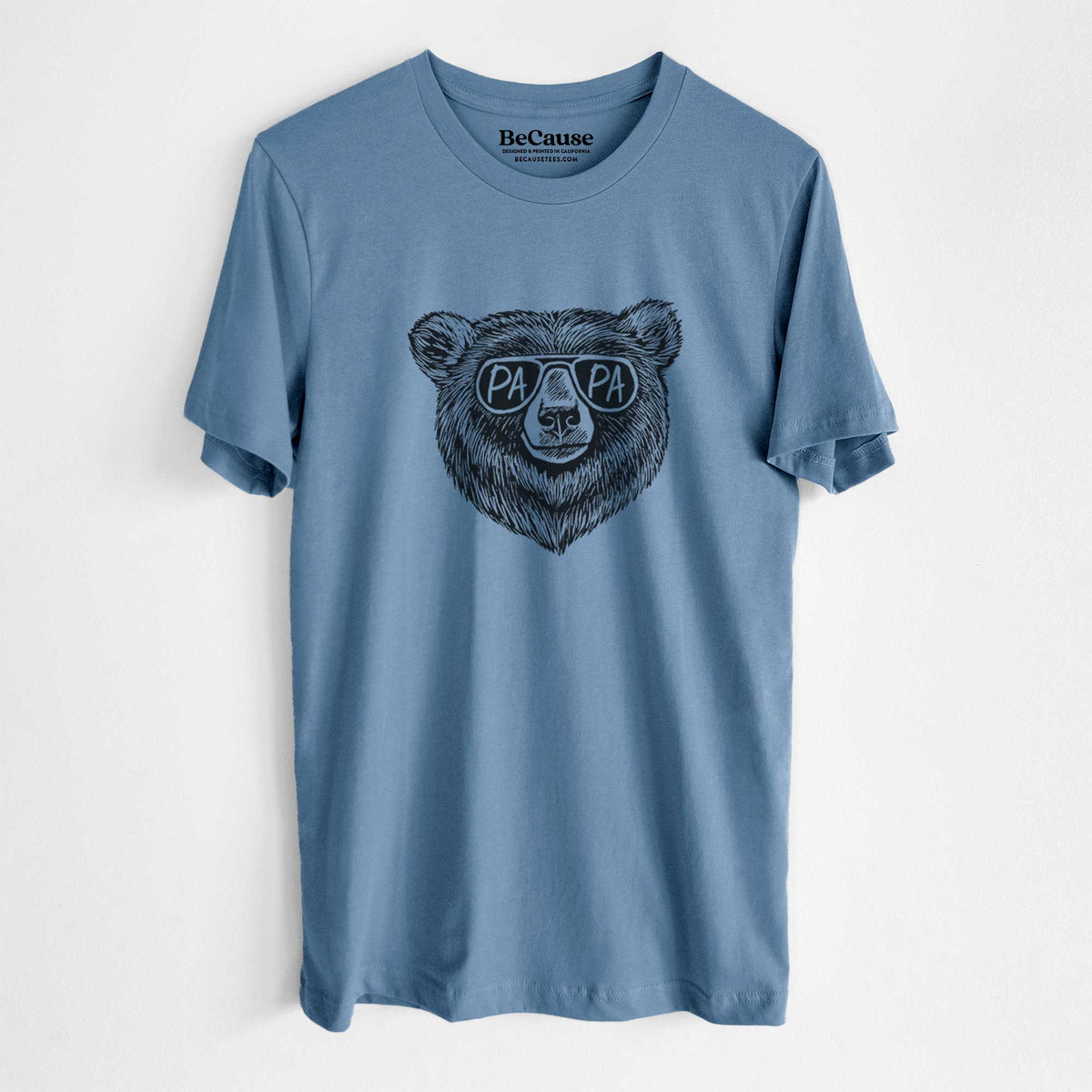 Steel blue lightweight cotton t-shirt laid flat, printed with a black ink bear's face wearing sunglasses that read Papa.