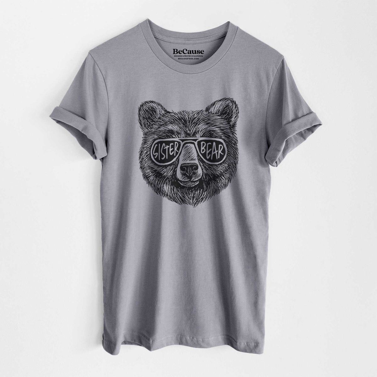 Storm grey lightweight cotton t-shirt laid flat, printed with a black ink bear's face wearing sunglasses that read Sister Bear.