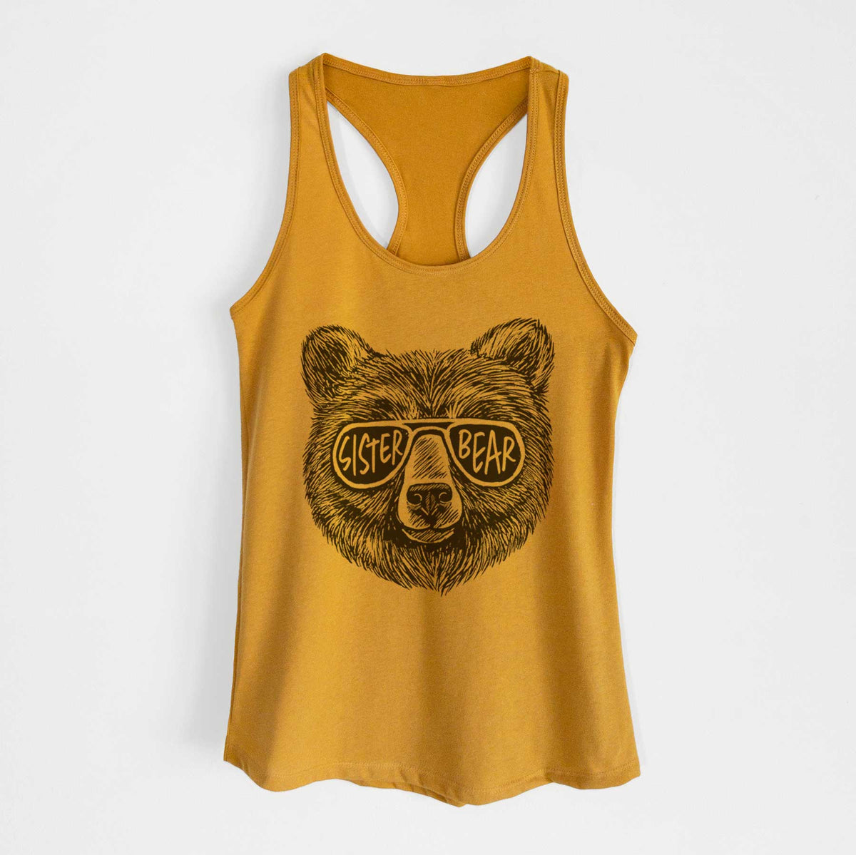 Gold women's racerback tank top laid flat, printed with a black ink bear's face wearing sunglasses that read Sister Bear.