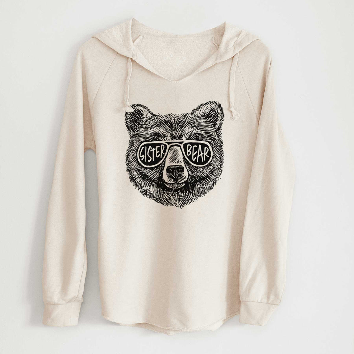 Bone cream women's Cali Wave hooded sweatshirt laid flat, printed with a black ink bear's face wearing sunglasses that read Sister Bear.