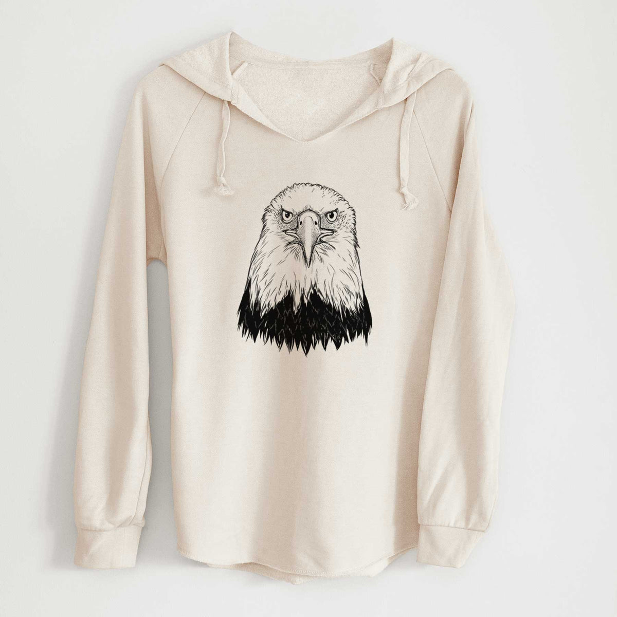 Bone cream women's Cali Wave hooded sweatshirt laid flat, printed with a detailed black ink portrait of a bald eagle facing forward.