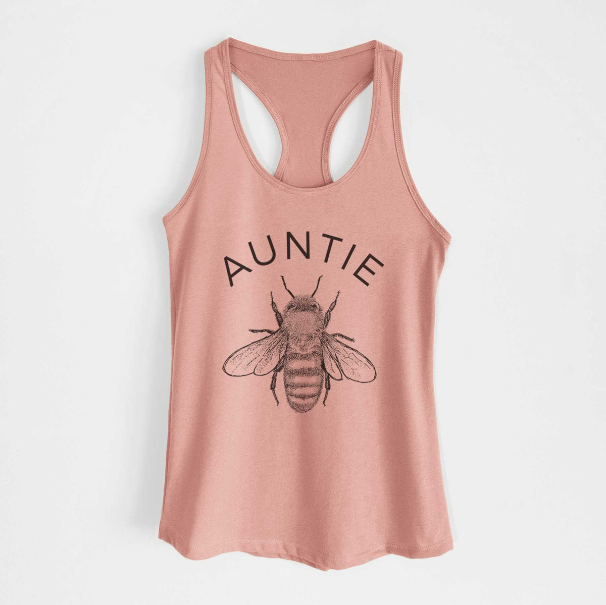 Desert pink women's racerback tank top laid flat, printed with a black ink honey bee beneath the word Auntie.