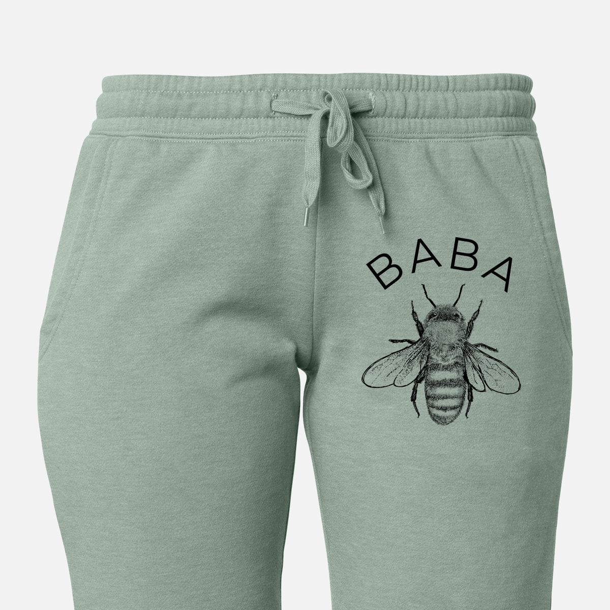 Front of sage green Cali Wave sweatpants, printed with a black ink honey bee beneath the word Baba on the leg.