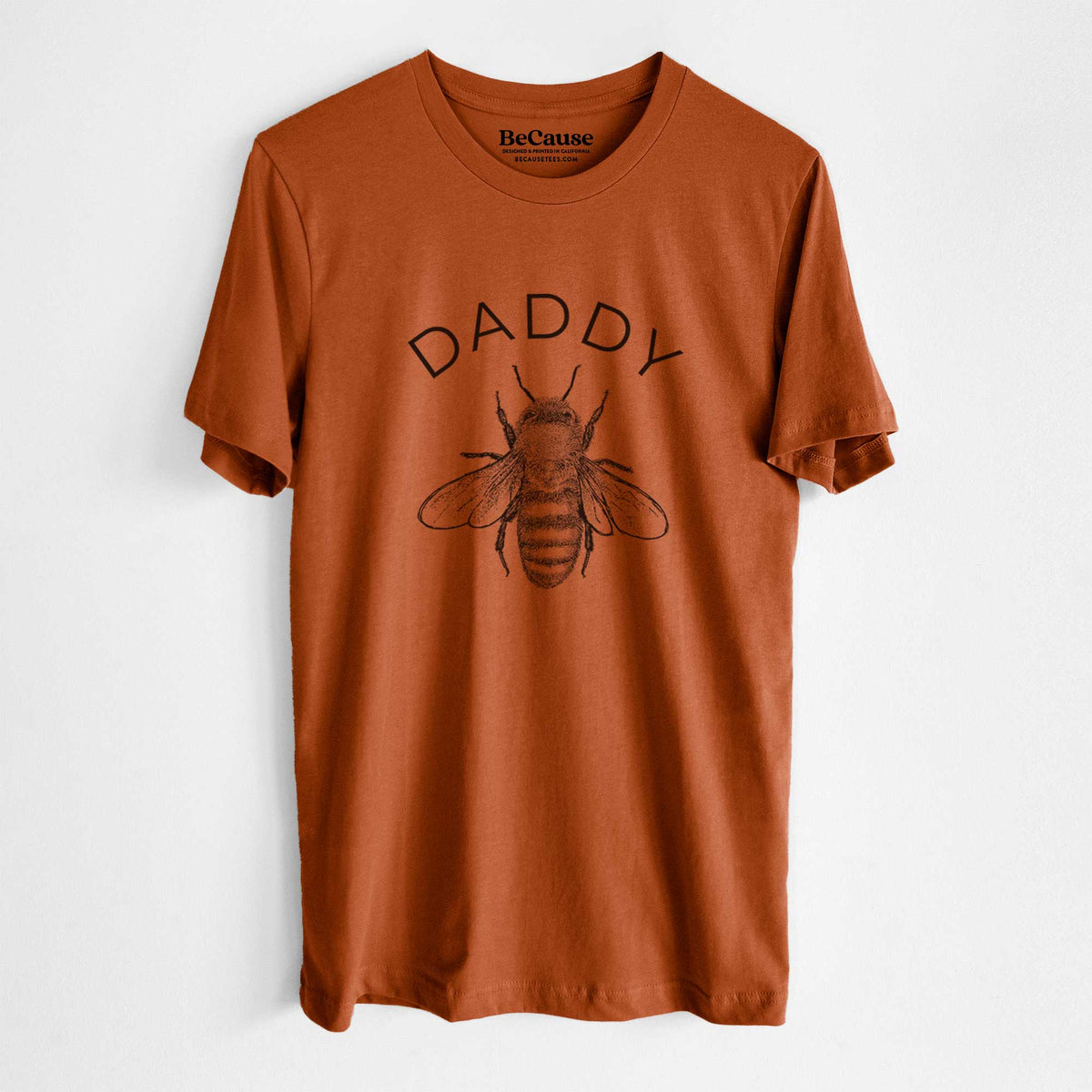 Autumn lightweight cotton t-shirt laid flat, printed with a black ink honey bee beneath the word Daddy.