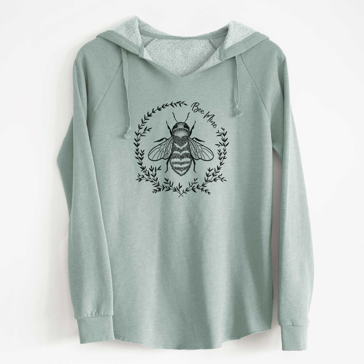Sage green women's Cali Wave hooded sweatshirt laid flat, printed with a black ink bee inside a wreath of leaves with the words Bee Mine.