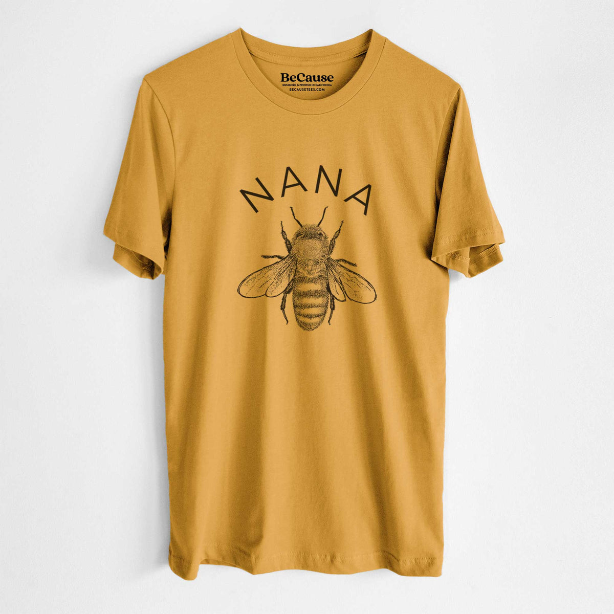 Mustard yellow lightweight cotton t-shirt laid flat, printed with a black ink honey bee beneath the word Nana.