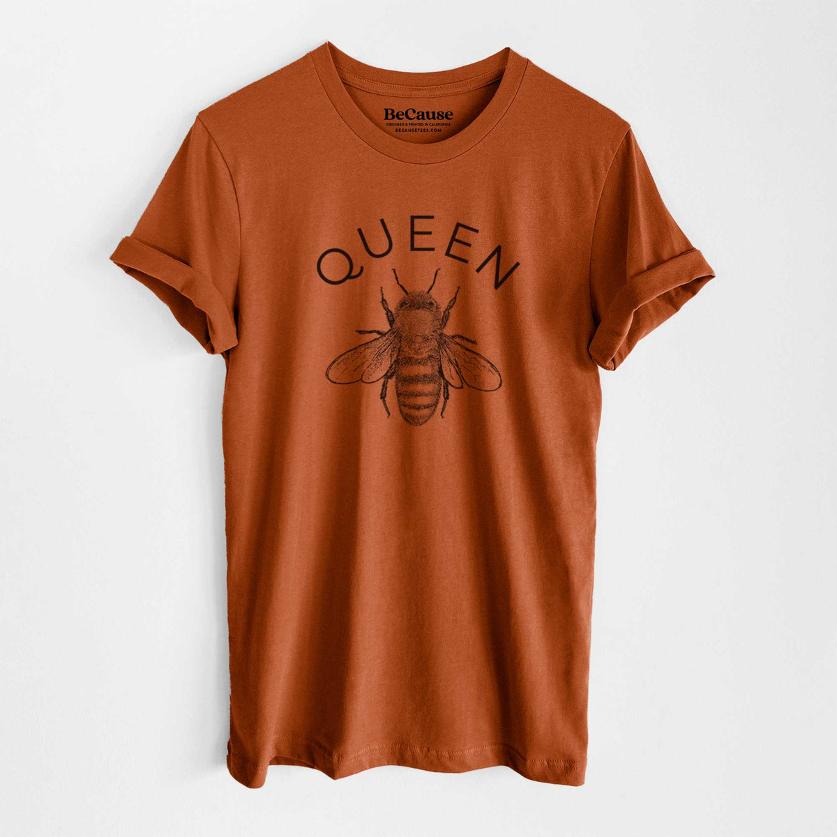 Autumn lightweight cotton t-shirt laid flat, printed with a black ink honey bee beneath the word Queen.