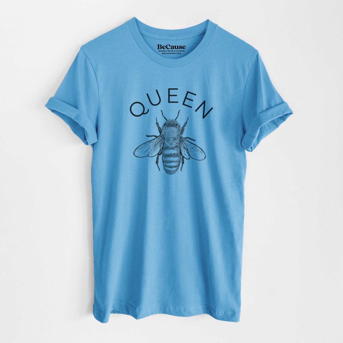 Ocean blue lightweight cotton t-shirt laid flat, printed with a black ink honey bee beneath the word Queen.