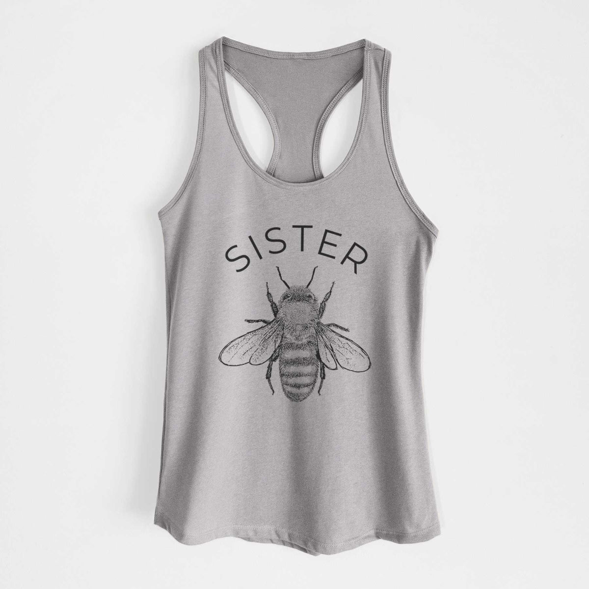Heather grey women's racerback tank top laid flat, printed with a black ink honey bee beneath the word Sister.