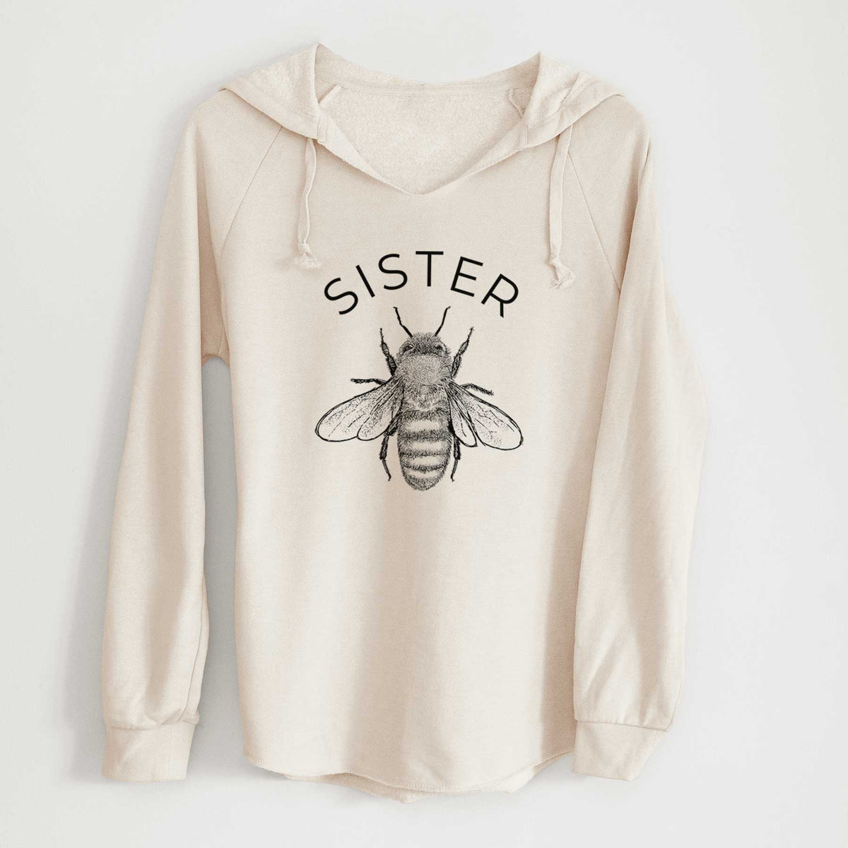 Bone cream women's Cali Wave hooded sweatshirt laid flat, printed with a black ink honey bee beneath the word Sister.