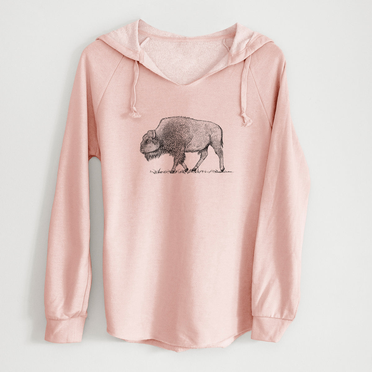 Blush pink women's Cali Wave hooded sweatshirt laid flat, printed with a detailed black ink illustration of an American bison walking through grass.