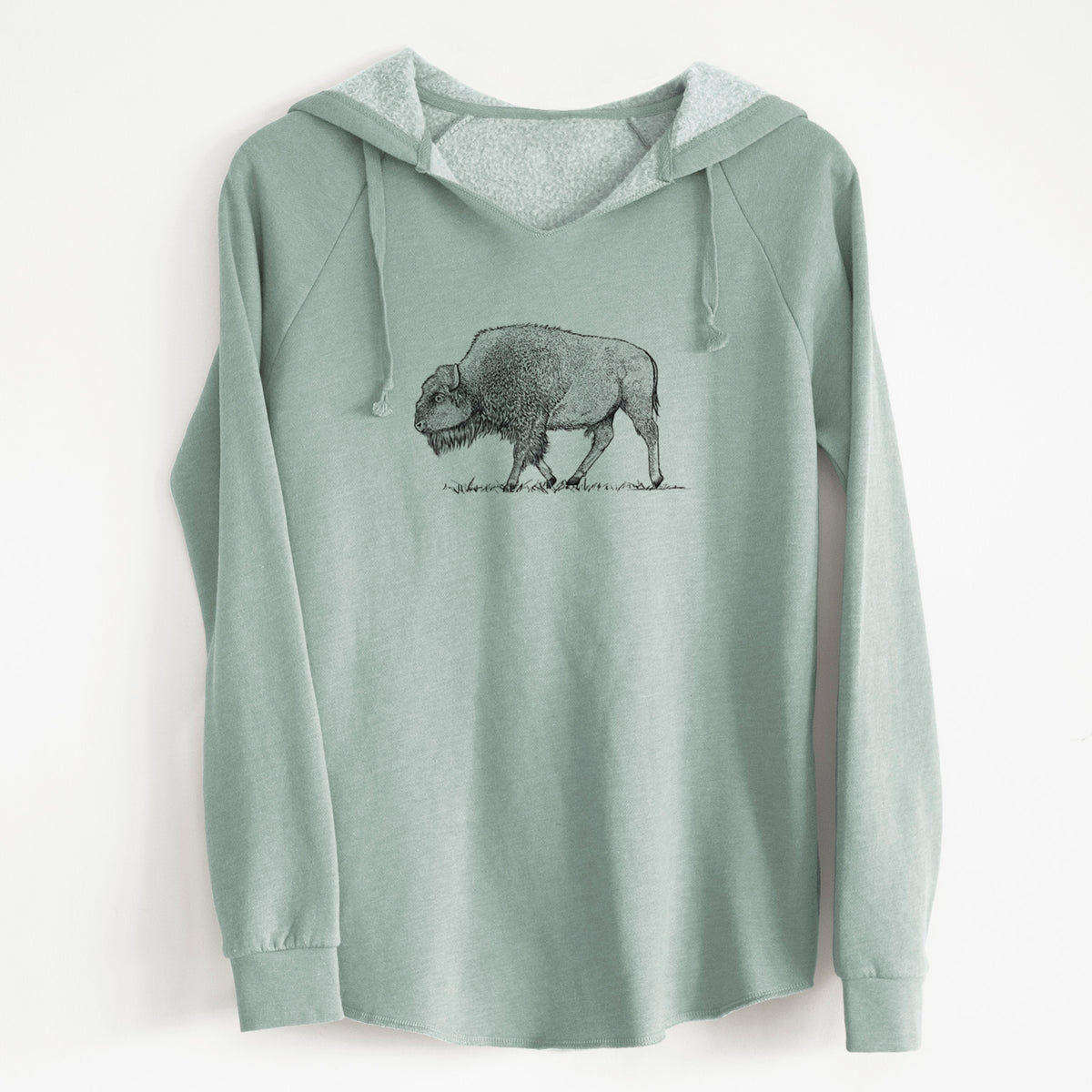 Sage green women's Cali Wave hooded sweatshirt laid flat, printed with a detailed black ink illustration of an American bison walking through grass.