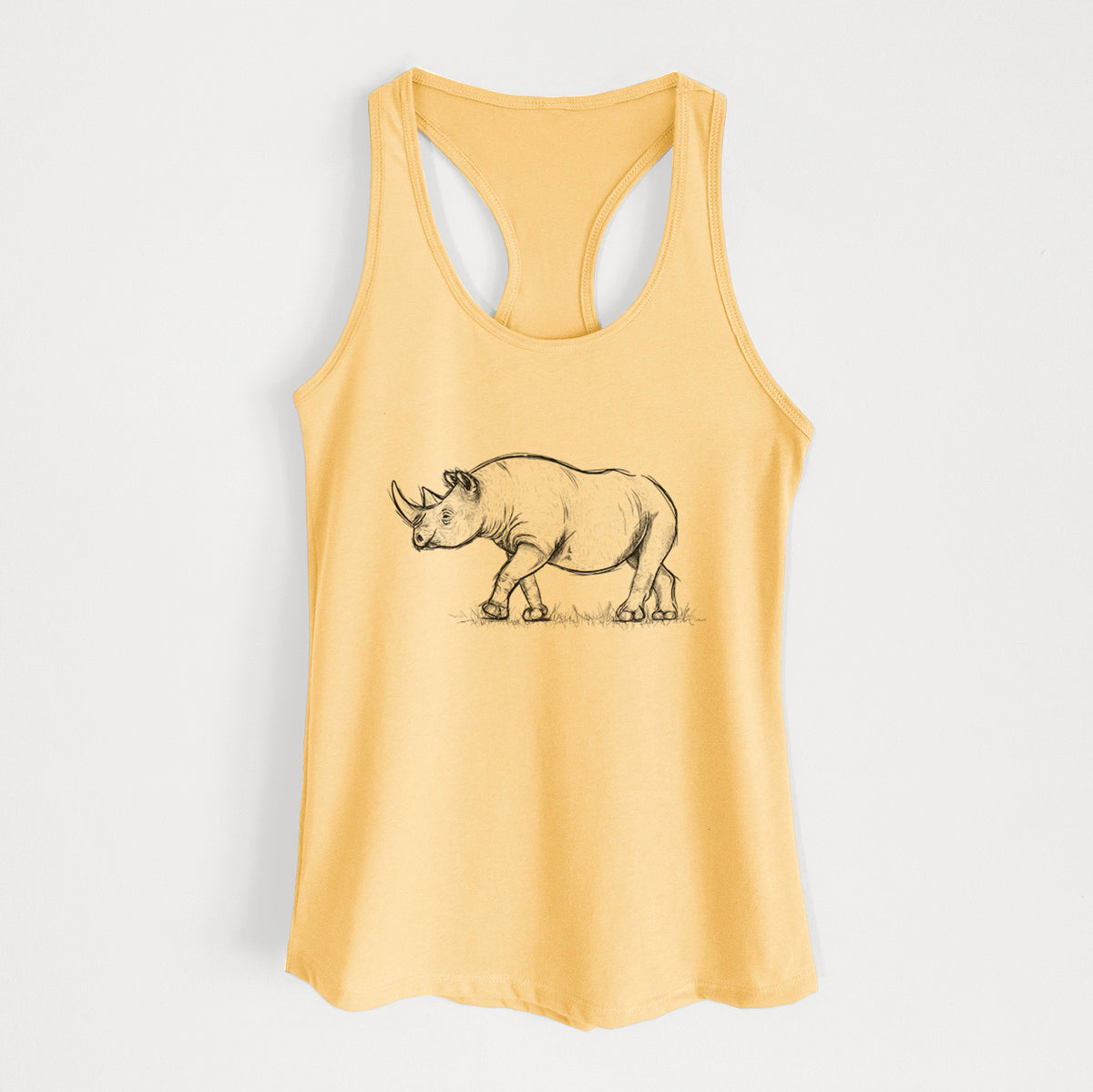 Banana cream women's racerback tank top laid flat, printed with a black ink illustration of a black rhinoceros walking.