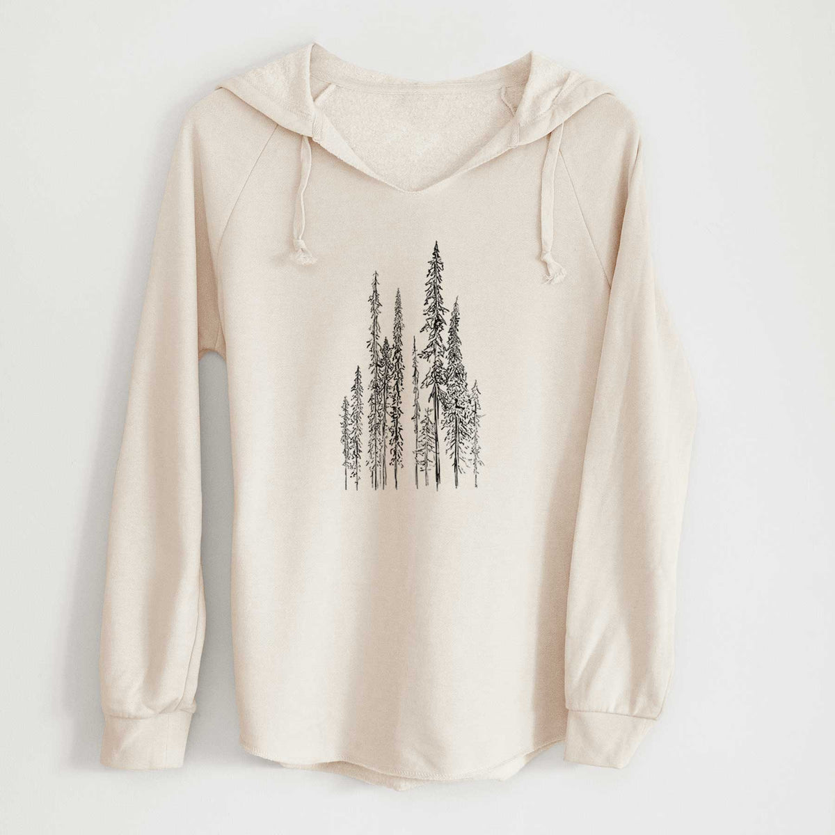 Bone cream women's Cali Wave hooded sweatshirt laid flat, printed with a black ink illustration of a stand of tall, narrow black spruce trees.