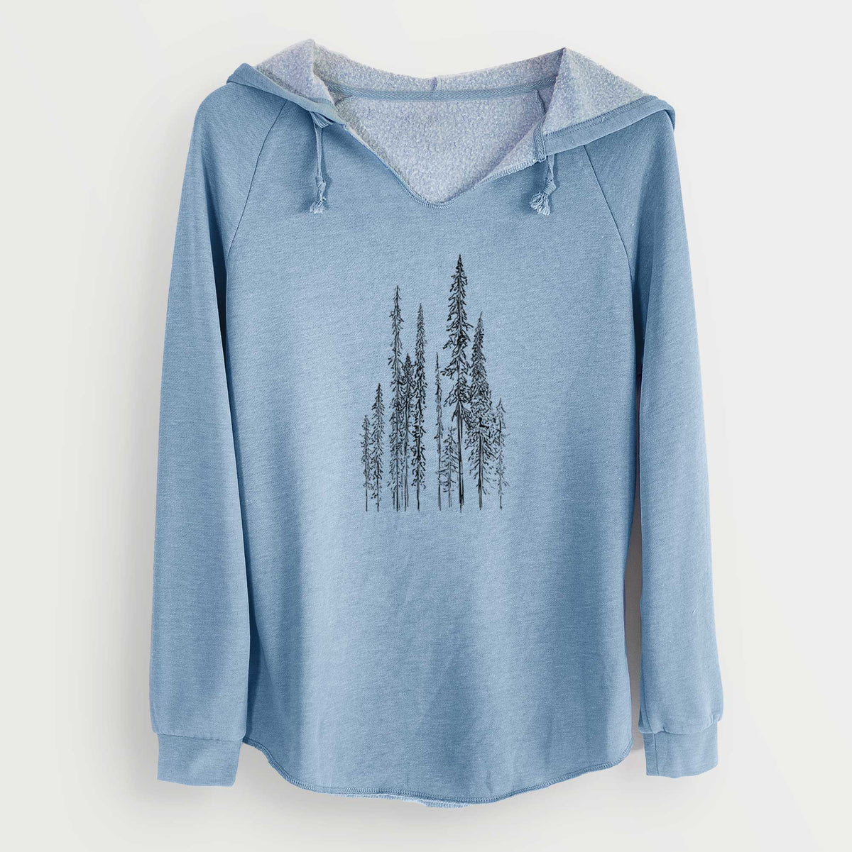 Misty blue women's Cali Wave hooded sweatshirt laid flat, printed with a black ink illustration of a stand of tall, narrow black spruce trees.