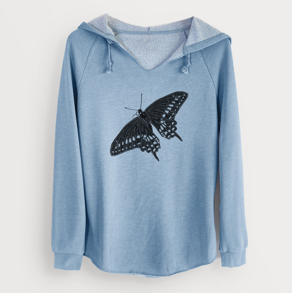 Misty blue women's Cali Wave hooded sweatshirt laid flat, printed with a detailed black ink illustration of a black swallowtail butterfly with its wings spread.
