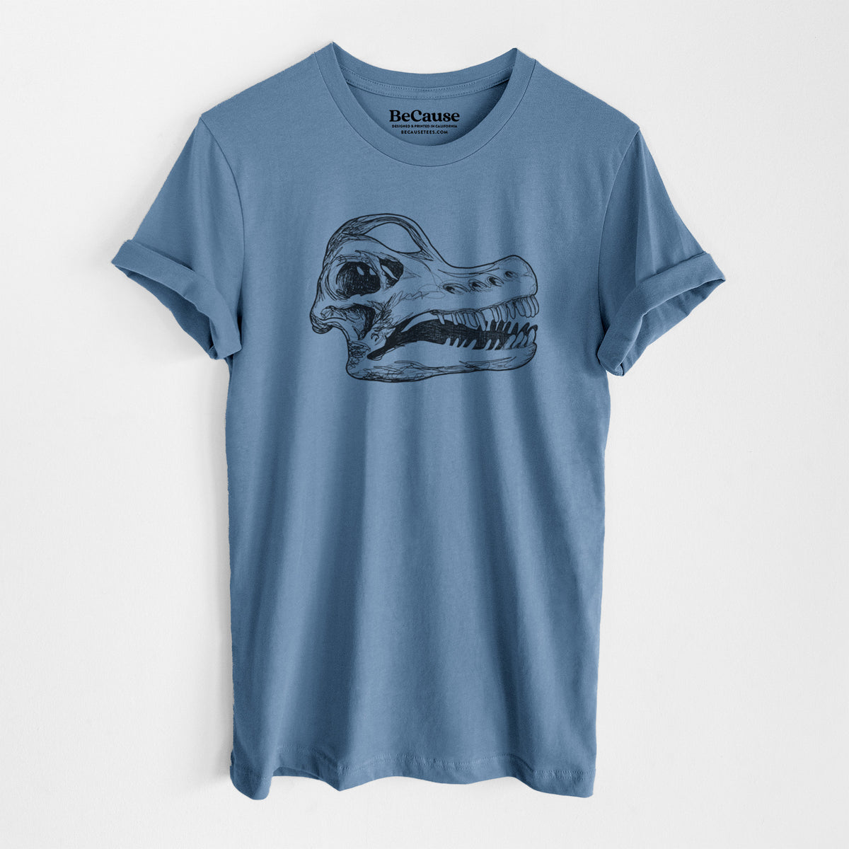 Steel blue lightweight cotton t-shirt laid flat, printed with a detailed black ink illustration of a Brachiosaurus skull.