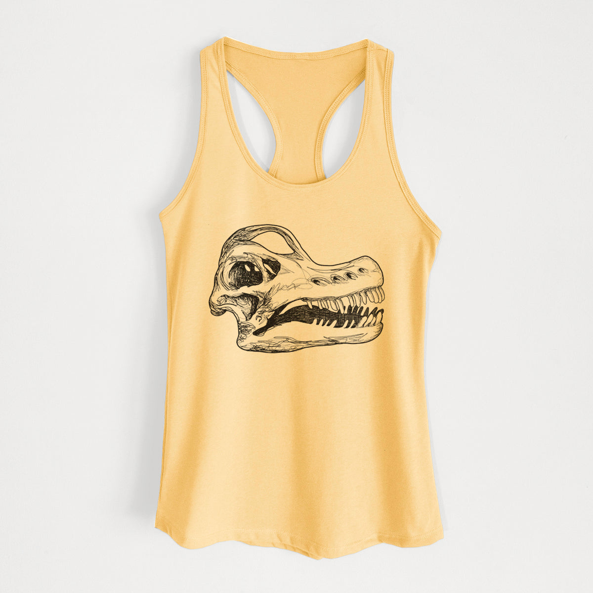 Banana cream women's racerback tank top laid flat, printed with a detailed black ink illustration of a Brachiosaurus skull.