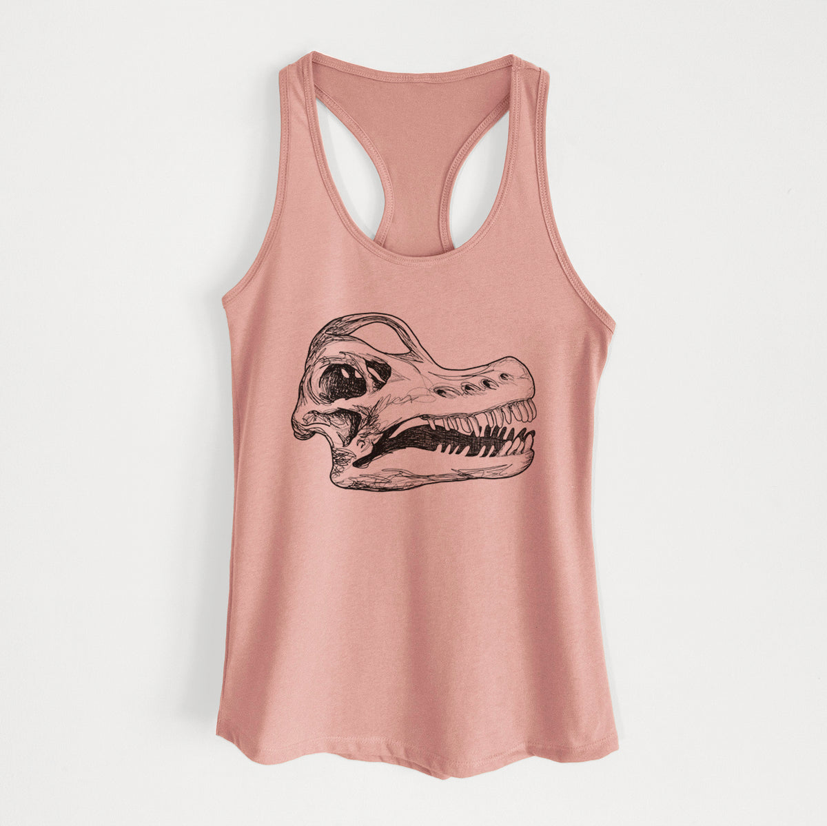 Desert pink women's racerback tank top laid flat, printed with a detailed black ink illustration of a Brachiosaurus skull.