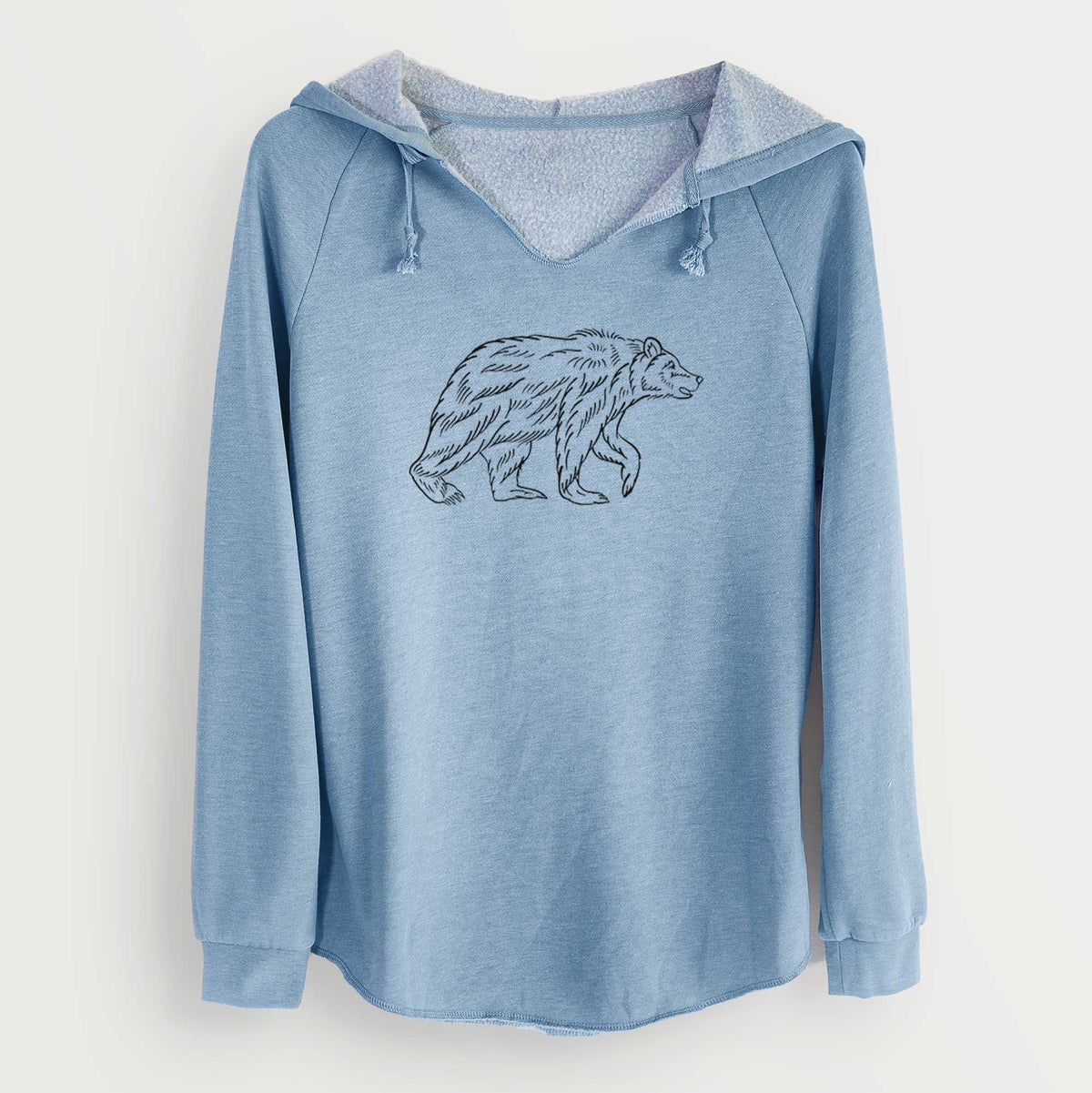Misty blue women's Cali Wave hooded sweatshirt laid flat, printed with a black ink illustration of a brown bear walking.