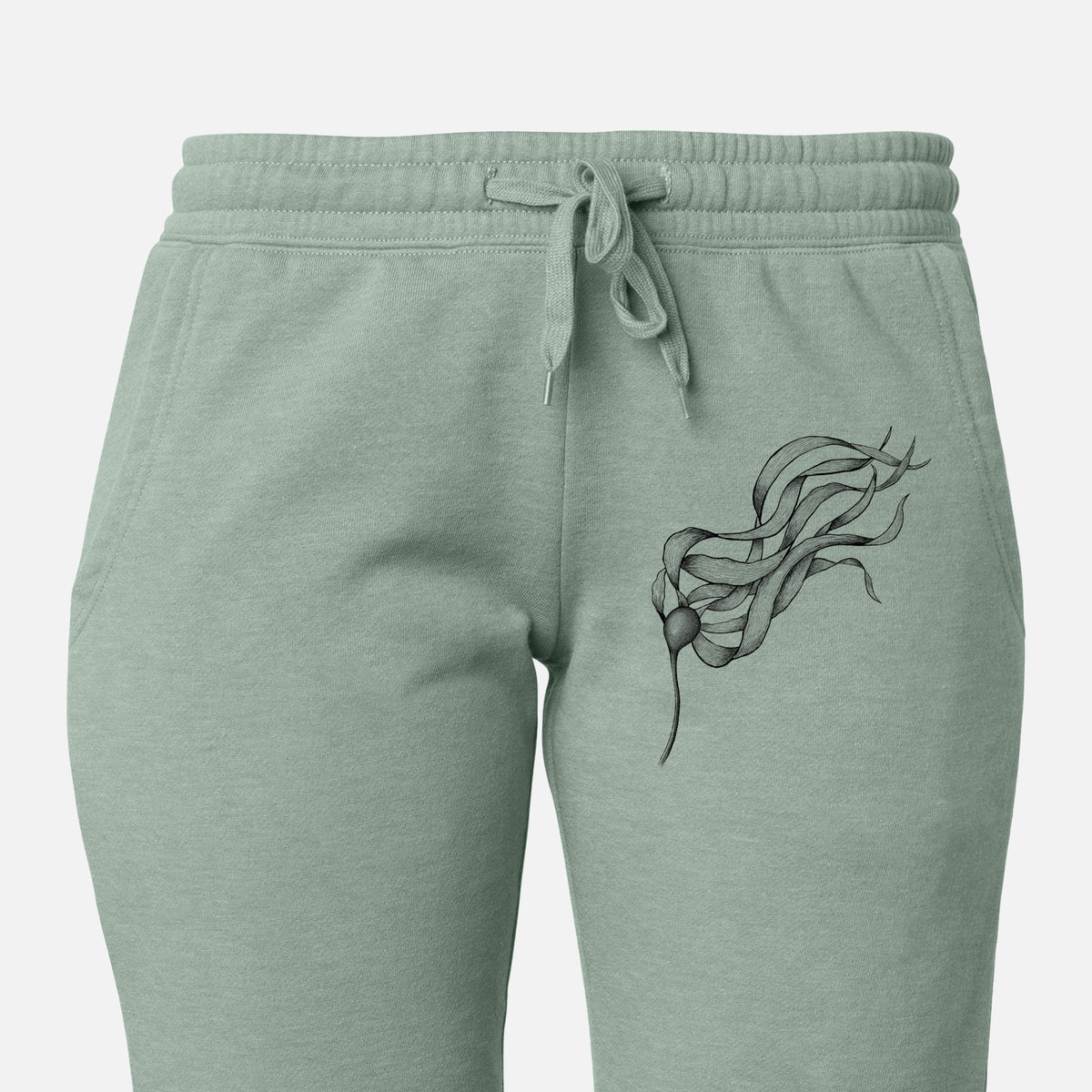 Front of sage green Cali Wave sweatpants, printed with a black ink line drawing of a strand of bull kelp with long flowing blades on the leg.