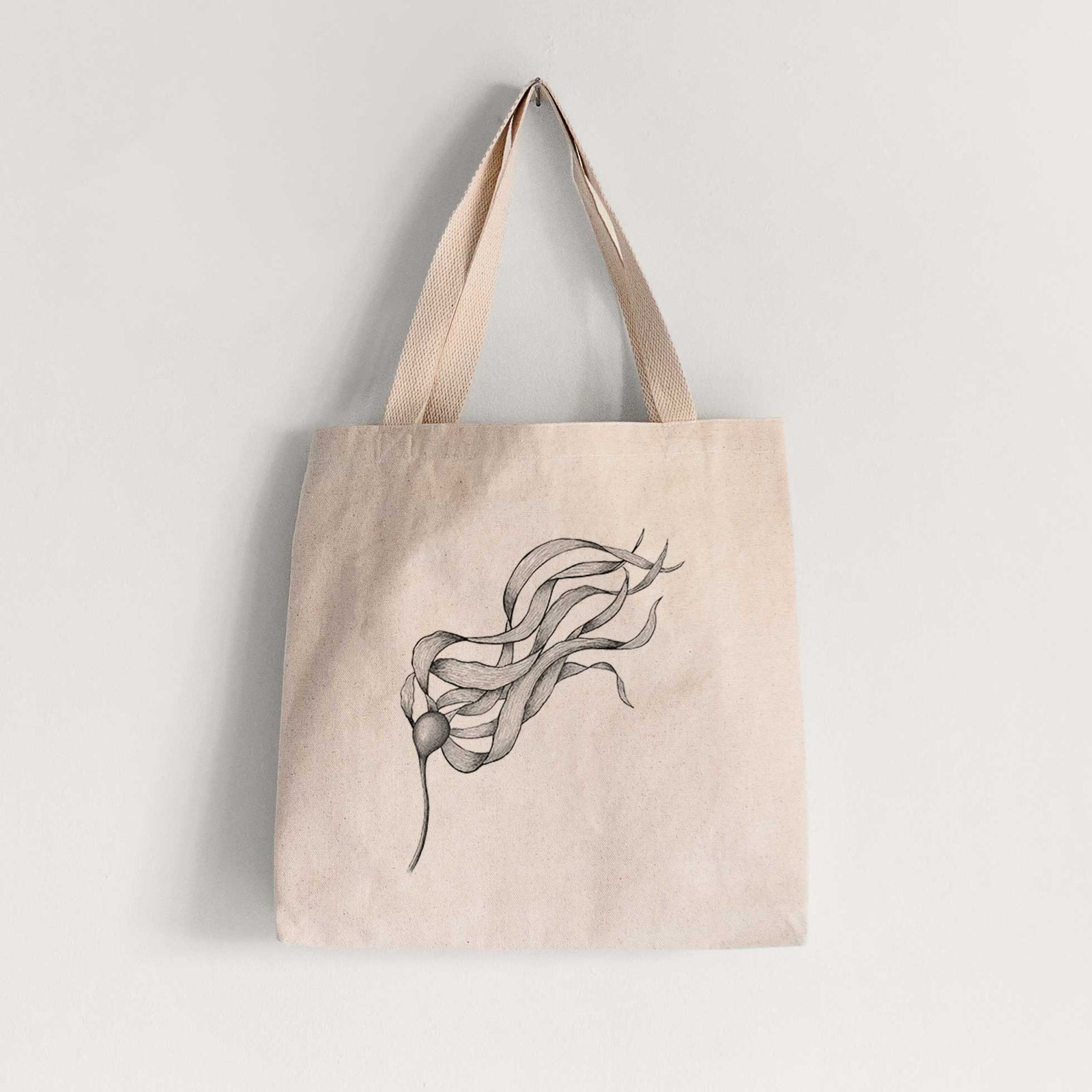 Natural canvas tote bag printed with a black ink line drawing of a strand of bull kelp with long flowing blades.