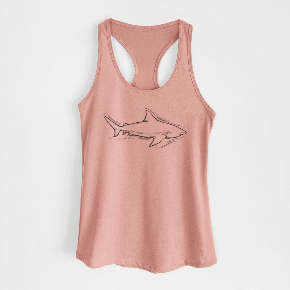 Desert pink women's racerback tank top laid flat, printed with a black ink illustration of a bull shark swimming.