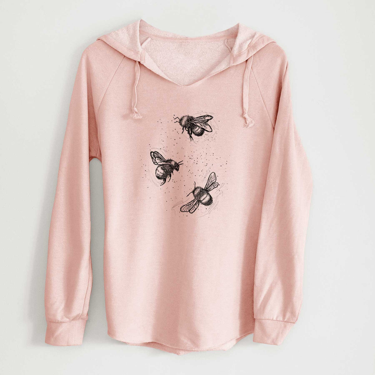 Blush pink women's Cali Wave hooded sweatshirt laid flat, printed with a black ink illustration of three bumble bees flying.