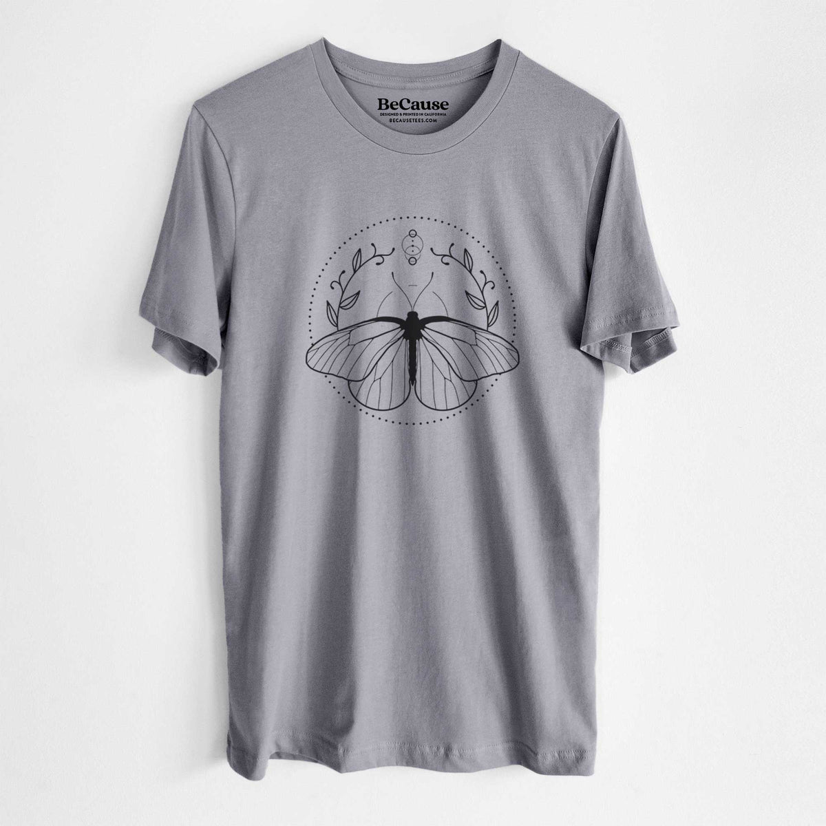 Storm grey lightweight cotton t-shirt laid flat, printed with a black ink butterfly inside a circle, framed by moon phases and leaves.