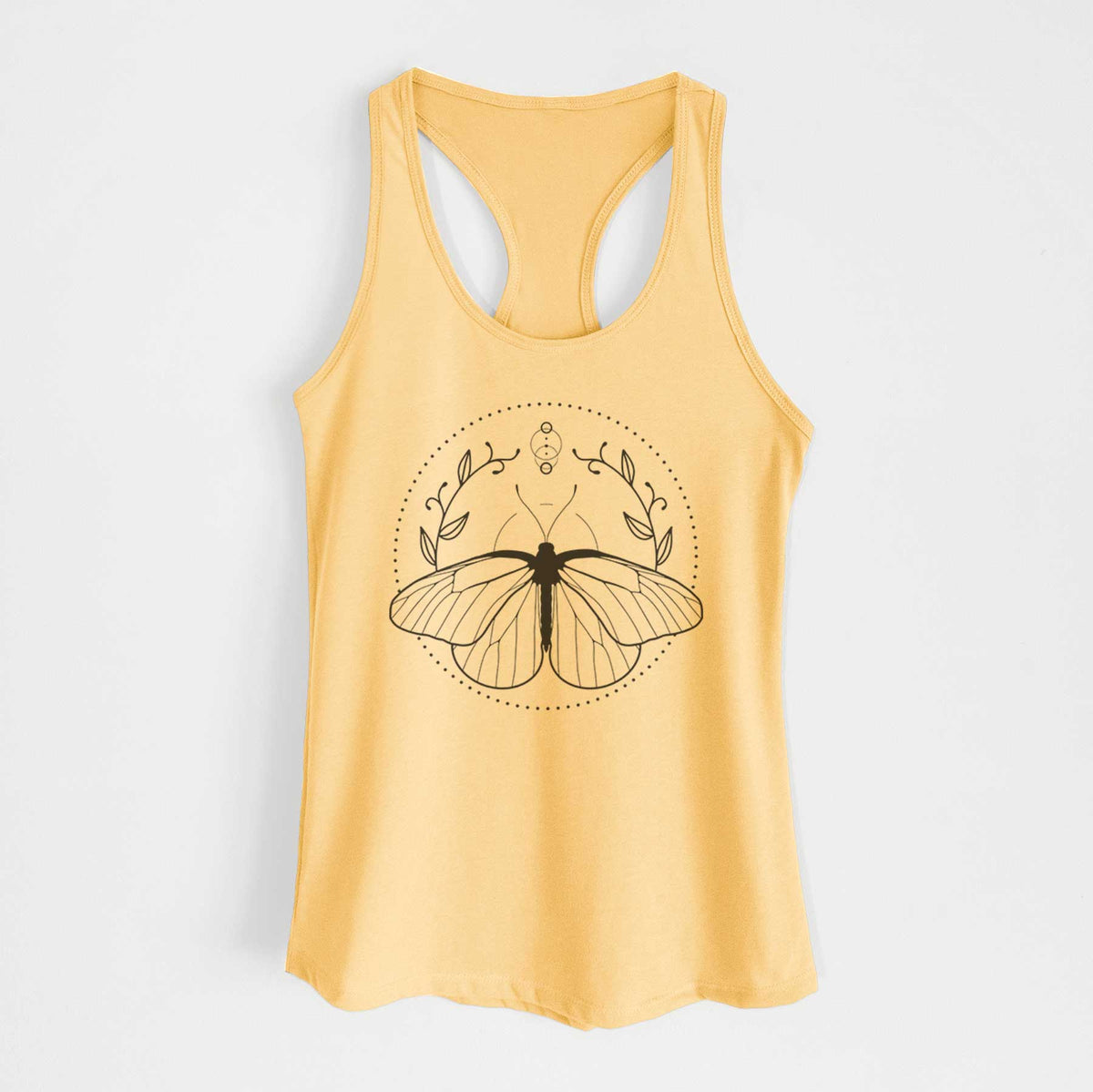 Banana cream women's racerback tank top laid flat, printed with a black ink butterfly inside a circle, framed by moon phases and leaves.