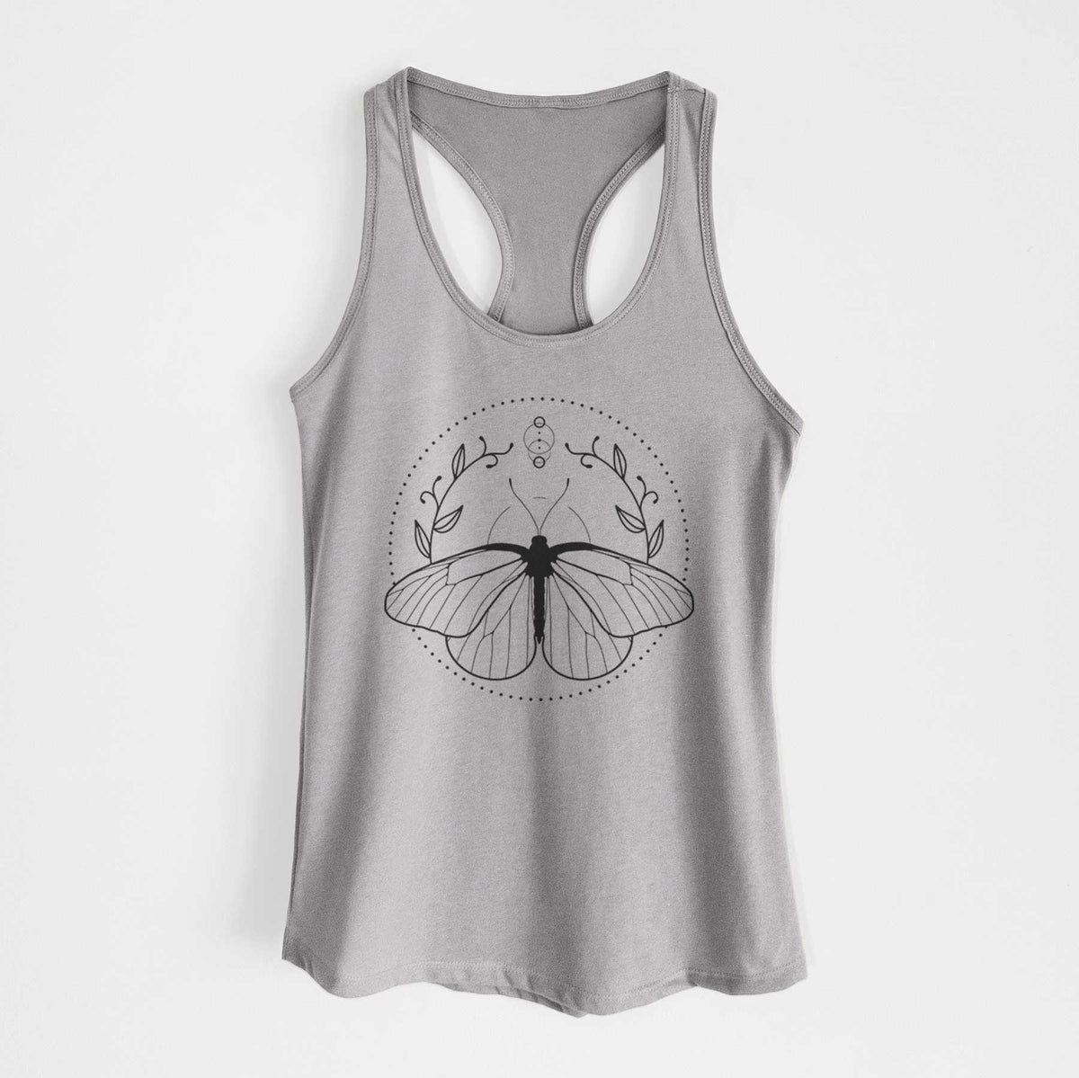 Heather grey women's racerback tank top laid flat, printed with a black ink butterfly inside a circle, framed by moon phases and leaves.