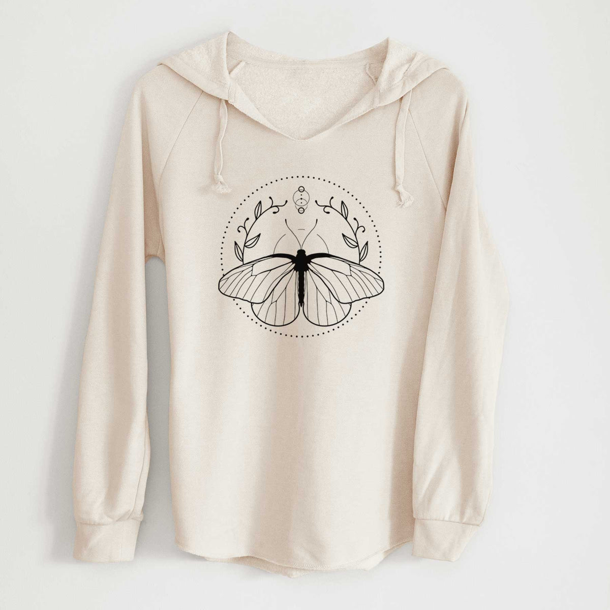 Bone cream women's Cali Wave hooded sweatshirt laid flat, printed with a black ink butterfly inside a circle, framed by moon phases and leaves.
