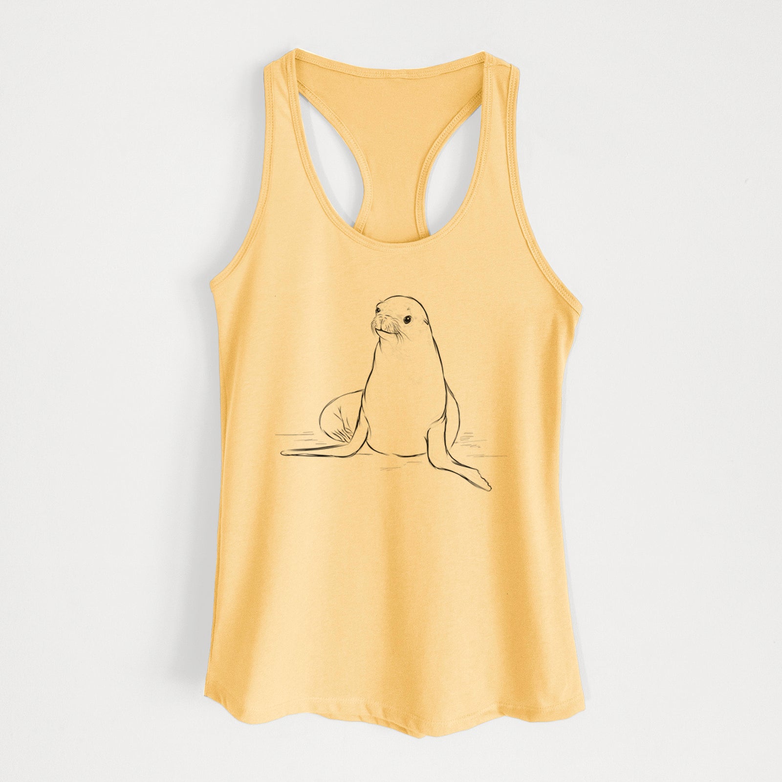 Banana cream women's racerback tank top laid flat, printed with a black ink illustration of a California sea lion sitting upright.