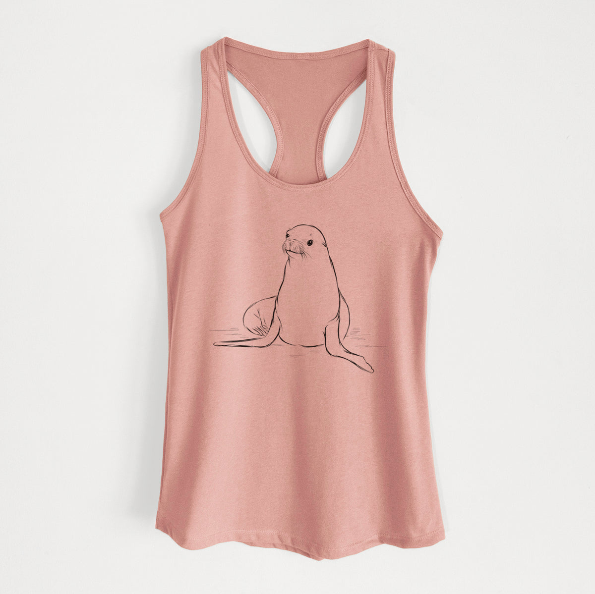 Desert pink women's racerback tank top laid flat, printed with a black ink illustration of a California sea lion sitting upright.