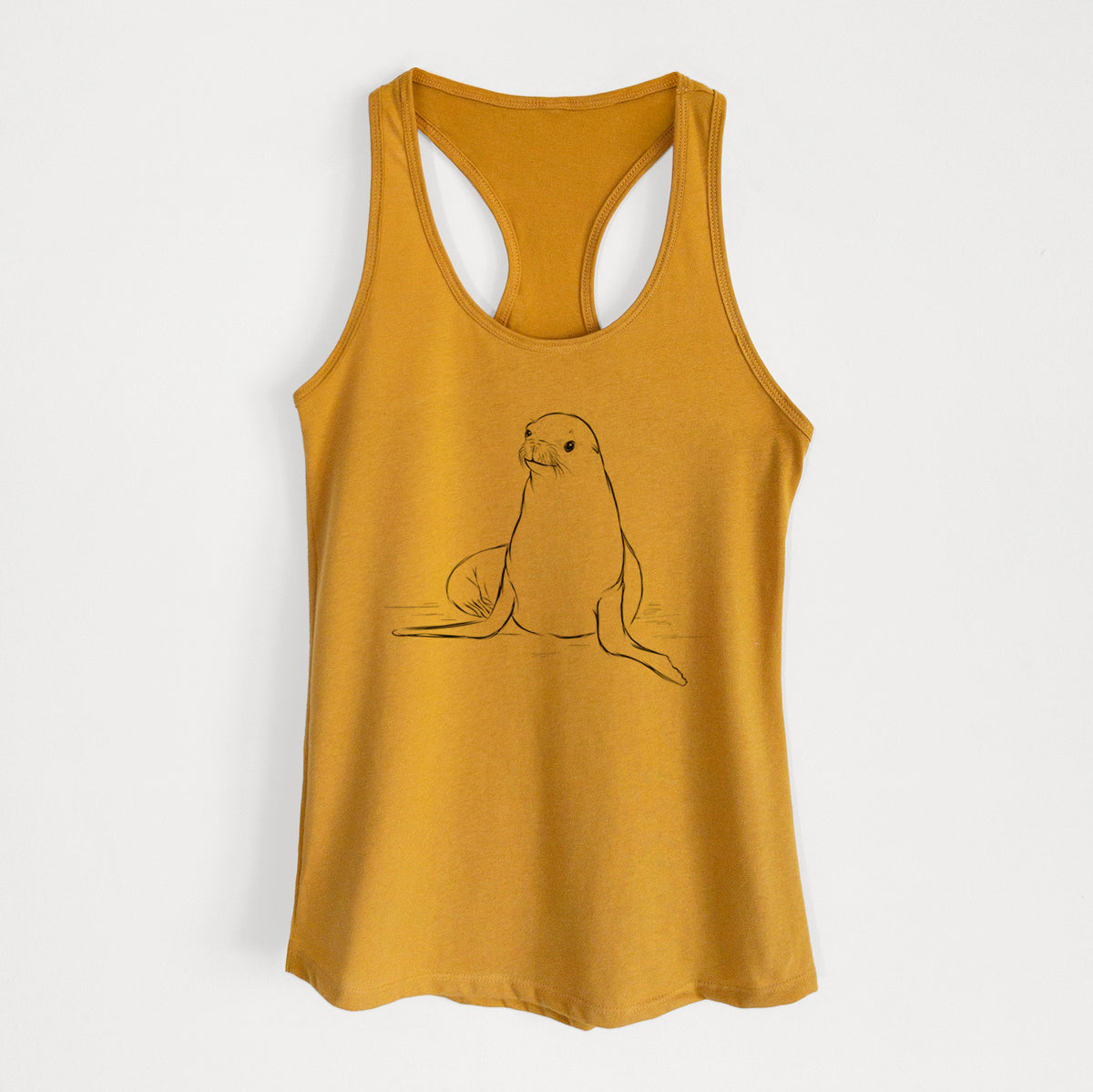 Gold women's racerback tank top laid flat, printed with a black ink illustration of a California sea lion sitting upright.