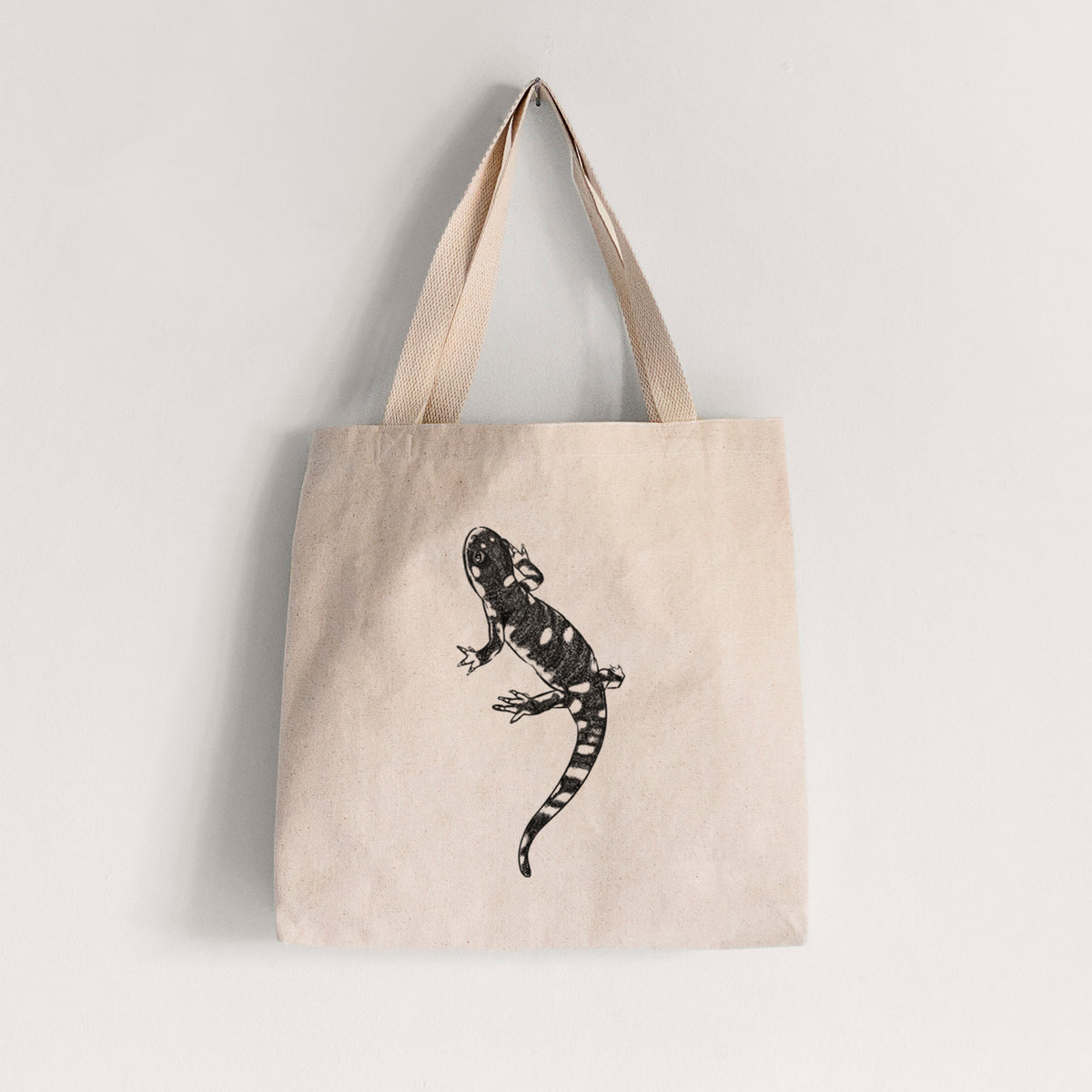 Natural canvas tote bag printed with a detailed black ink illustration of a spotted California tiger salamander.