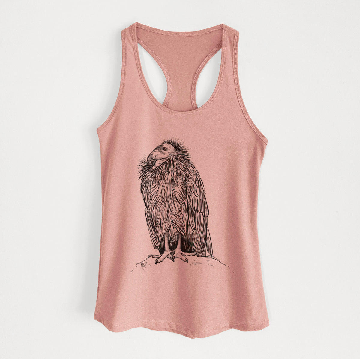 Desert pink women's racerback tank top laid flat, printed with a detailed black ink illustration of a California condor perched with folded wings.